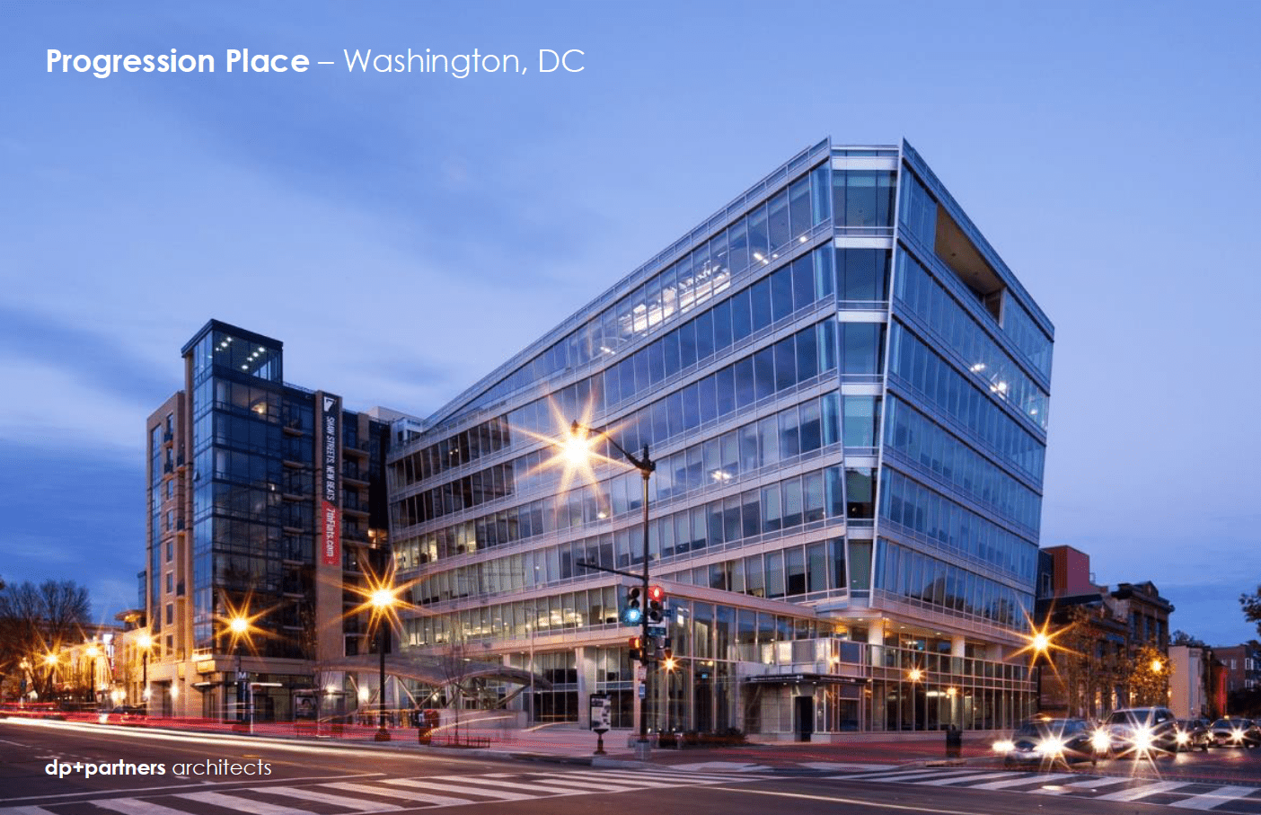 A large building with lights on the side of it.